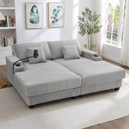 Modern chaise sofa in gray ribbed fabric with black feet in a bright living room with plant on Tampa Home & Garden Store