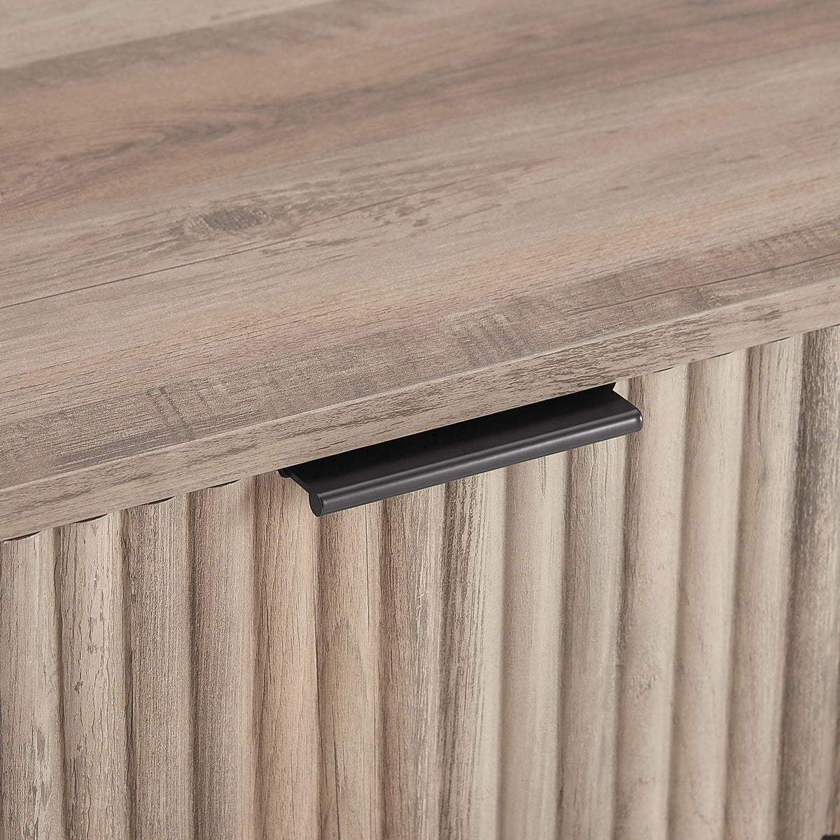 Modern nightstand with gray-washed wood finish and black metal handle on Tampa Home & Garden Store
