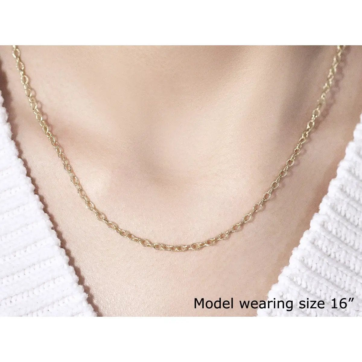 2.5mm 14k yellow gold pendant chain with textured links necklace on model in white robe on Tampa Home & Garden Store