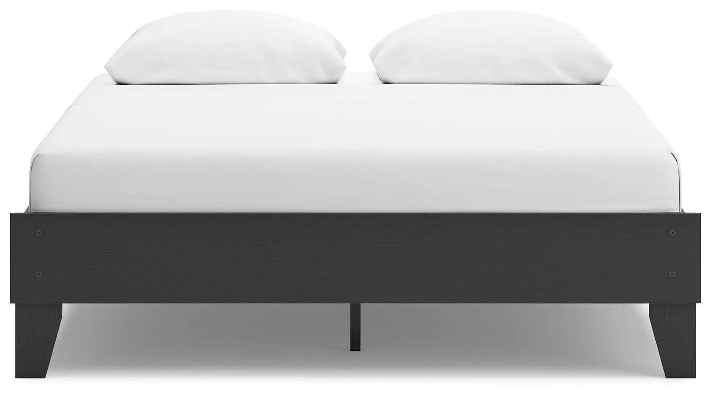 Socalle platform bed in dark wood with white bedding and two pillows on Tampa Home & Garden Store