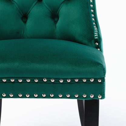 Tufted velvet dining chair in emerald green with silver nailhead trim button-tufted back on Tampa Home & Garden Store