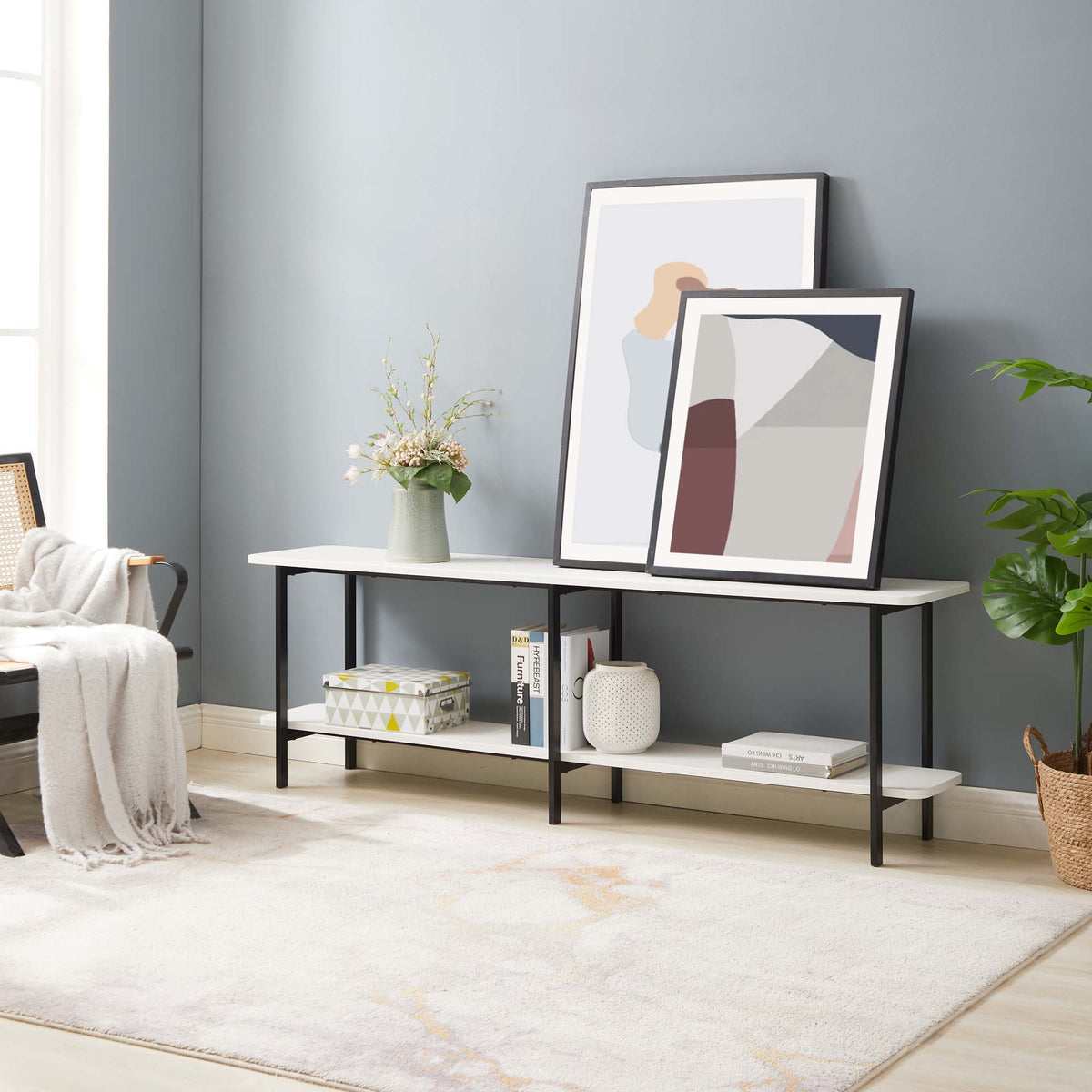 Celine 2-Shelf Console Table with black metal frame and white top; two prints and vase on Tampa Home & Garden Store