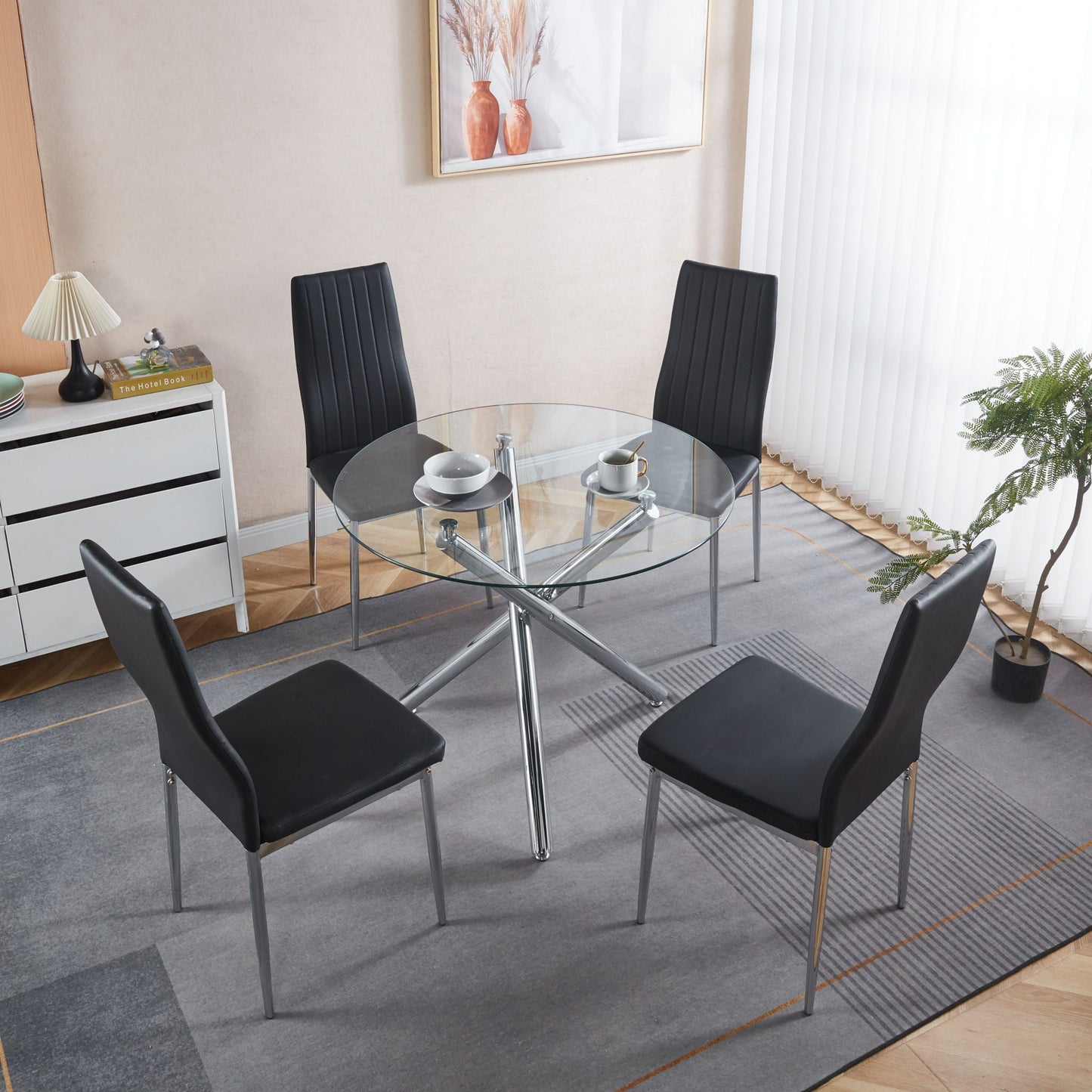 Minimalist Design Dining Chair Set of 4 black faux-leather with chrome legs around a glass table on Tampa Home & Garden Store