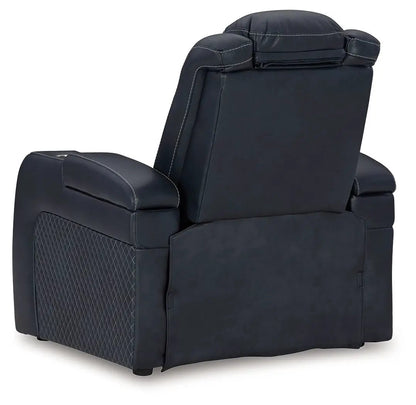 Fyne-dyme power recliner with adjustable headrest, dark navy upholstery, quilted side panel on Tampa Home & Garden Store
