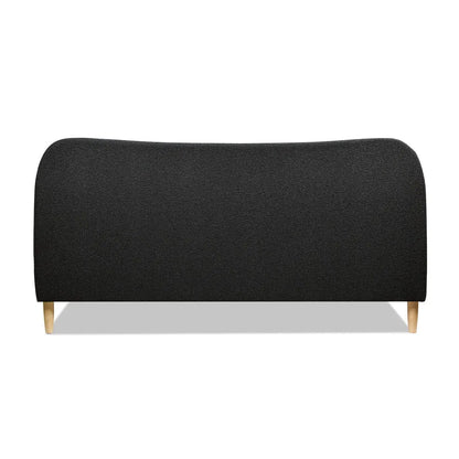 Roman curved headboard upholstered platform bed in black fabric with light wood legs on Tampa Home & Garden Store