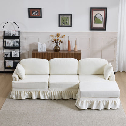White L-shaped sectional sofa with removable ruffled skirt and ottoman in a modern living room on Tampa Home & Garden Store
