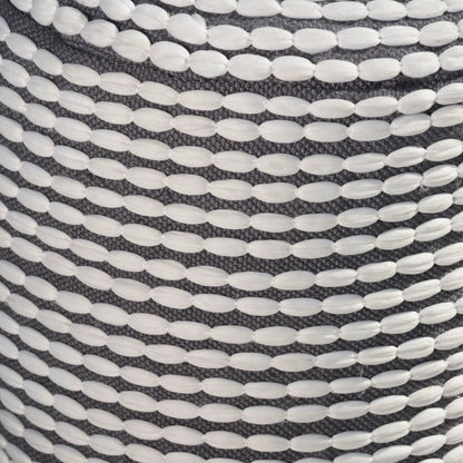 River cylindrical pouf with white bead detailing on dark woven fabric on Tampa Home & Garden Store