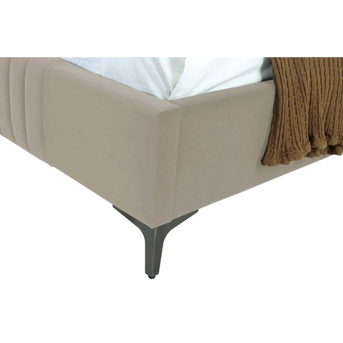 Promenade beige upholstered bed frame with metal legs, white sheets, and brown knit throw on Tampa Home & Garden Store