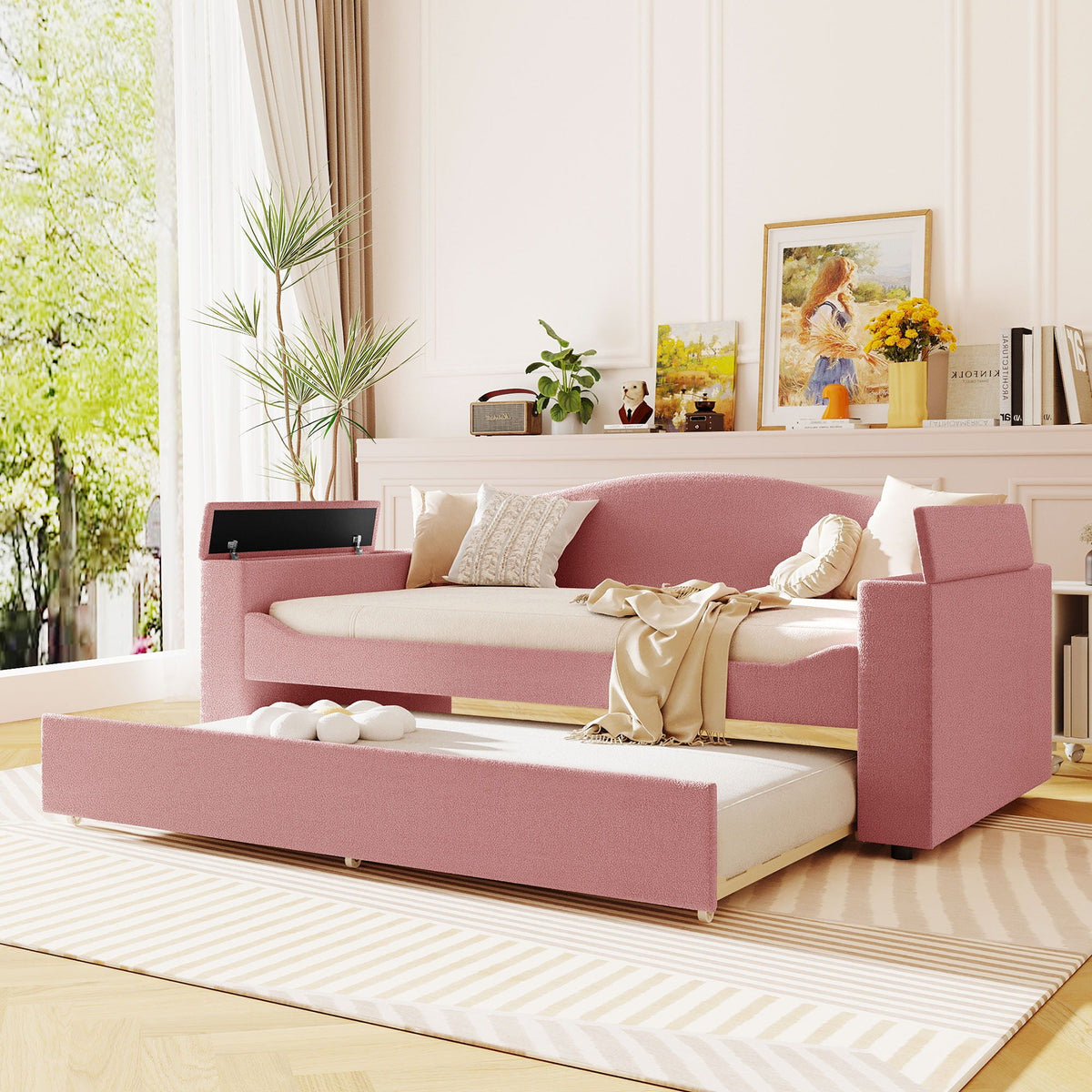 Upholstered pink daybed with storage arms and pull-out trundle by HouseOfZazla in a bright room on Tampa Home & Garden Store