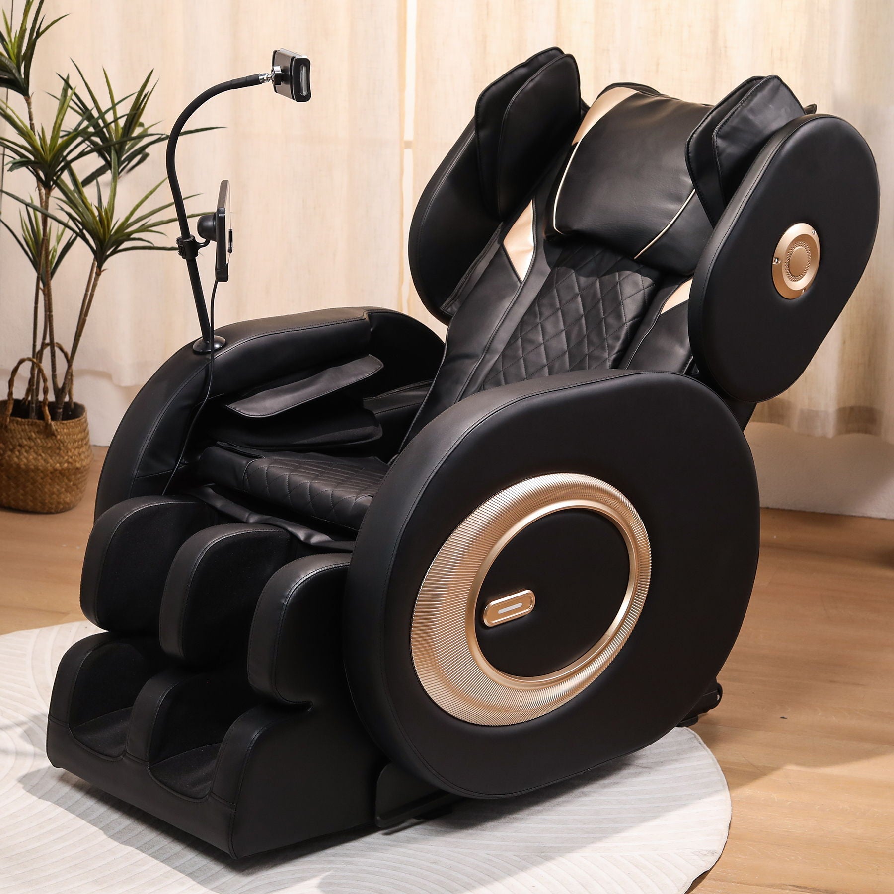 Automatic massage chair recliner in black leather with quilted seat and gold side panels on Tampa Home & Garden Store