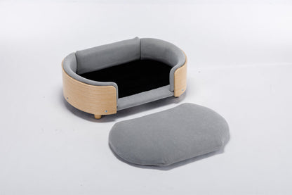 Scandinavian elevated dog bed mid-size with light grey velvet cushion and curved wood frame on Tampa Home & Garden Store
