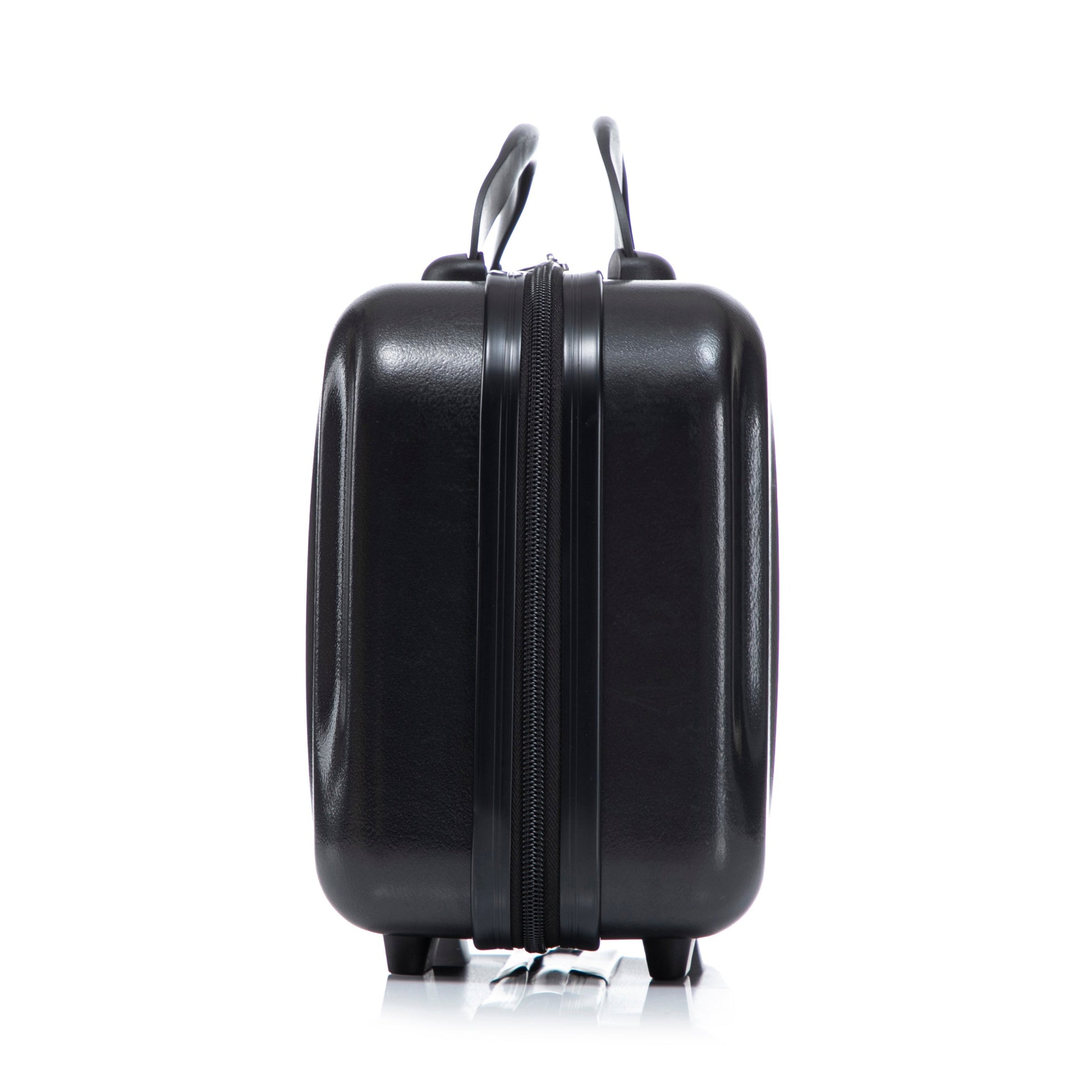 Black ABS hard-shell luggage with dual handles and center zipper, wheels visible on Tampa Home & Garden Store