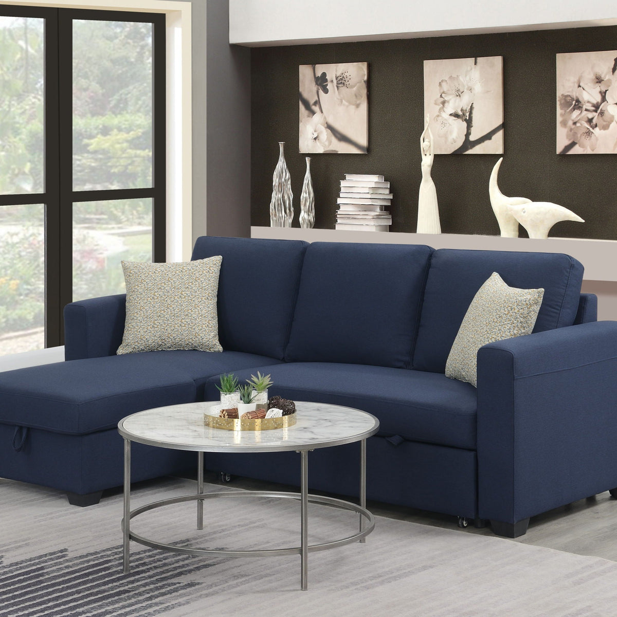 Reversible sleeper sectional in navy with hidden storage chaise in a modern living room on Tampa Home & Garden Store