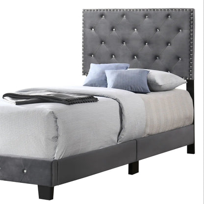 Luxurious Upholstered Bed with gray tufted headboard and buttons; white grid bedding, dark legs on Tampa Home & Garden Store