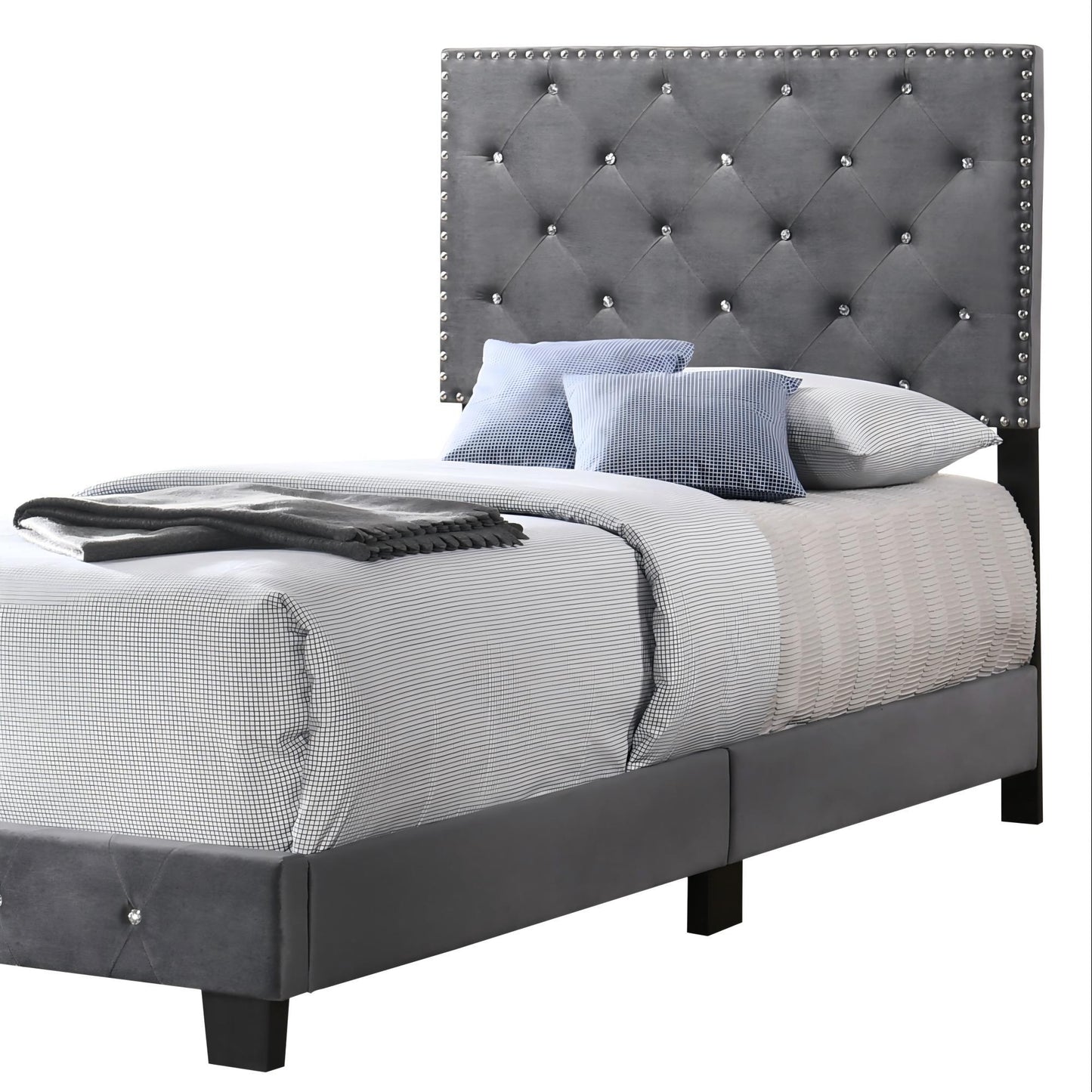 Luxurious upholstered bed with gray tufted headboard and nailhead trim on dark legs on Tampa Home & Garden Store