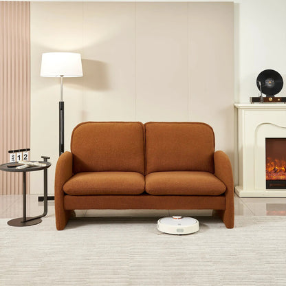 Loveseat sofa in warm brown sherpa upholstery in a living room with floor lamp on Tampa Home & Garden Store