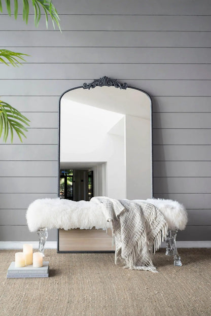 Arch Mirror with Baroque-inspired black ornate frame on gray paneled wall on Tampa Home & Garden Store