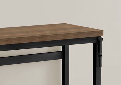 Adjustable standing computer desk with warm wood grain top and black metal frame on Tampa Home & Garden Store