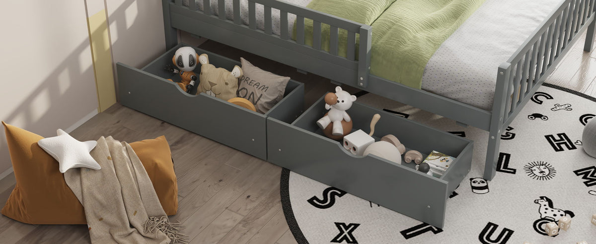 Platform bed with guardrails on both sides and 2 storage drawers in gray, filled with toys on Tampa Home & Garden Store