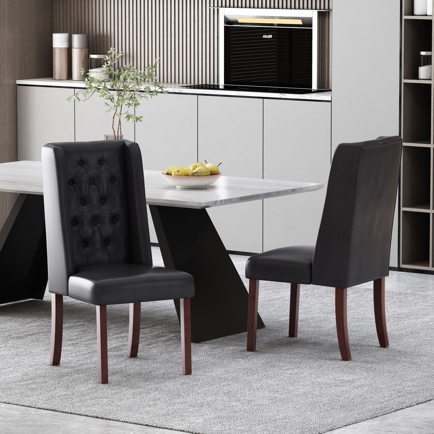 Four tufted dining chairs with high backs in black leather around a marble table on Tampa Home & Garden Store