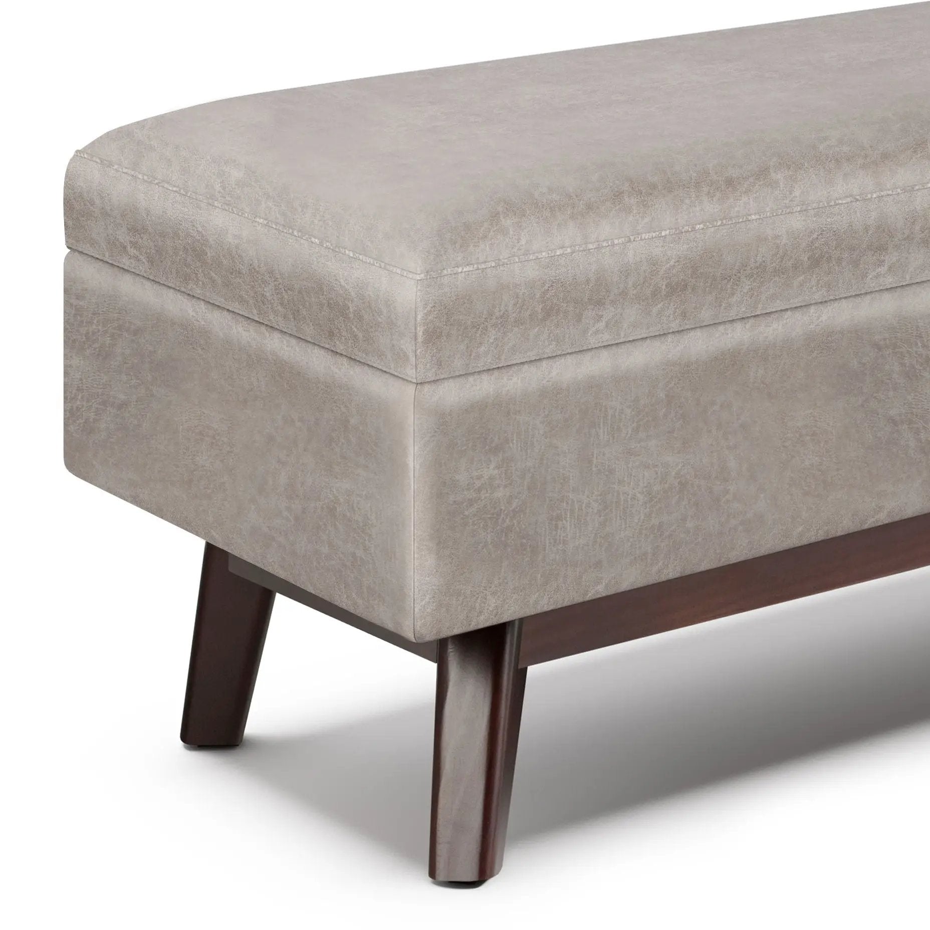 Owen upholstered rectangular storage ottoman in beige faux leather with dark wood legs on Tampa Home & Garden Store