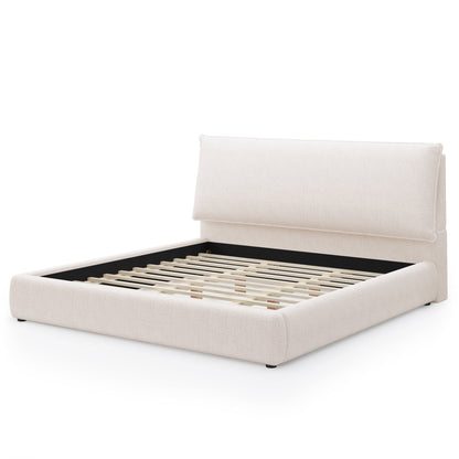 Upholstered platform bed frame with oversized plush headboard in beige fabric with slats on platform base on Tampa Home & Garden Store