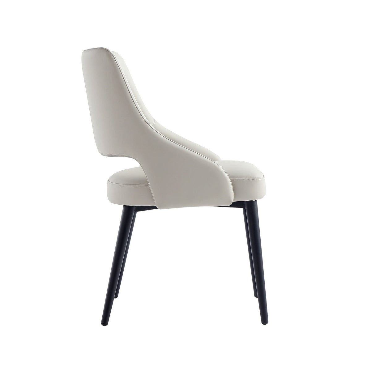 Tremont Dining Chair with beige upholstery and curved back, black steel legs on Tampa Home & Garden Store