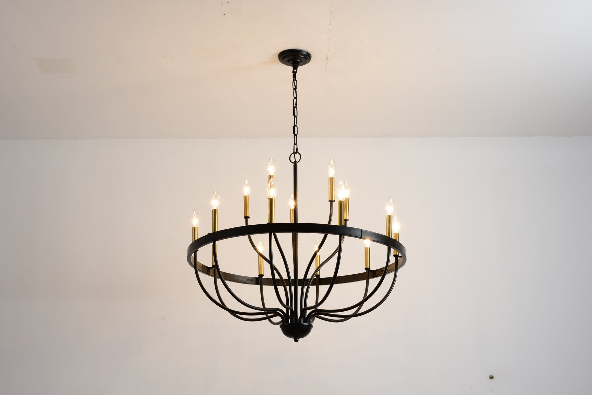 18-light industrial iron chandelier with black metal frame and gold candle holders, chain suspended on Tampa Home & Garden Store