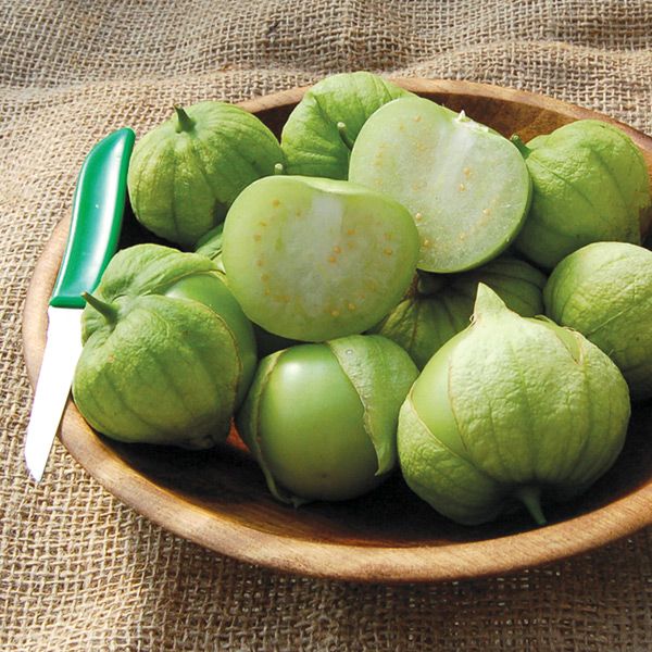 Toma Verde tomatillo fruits in a wooden bowl with a green-handled knife on Tampa Home & Garden Store