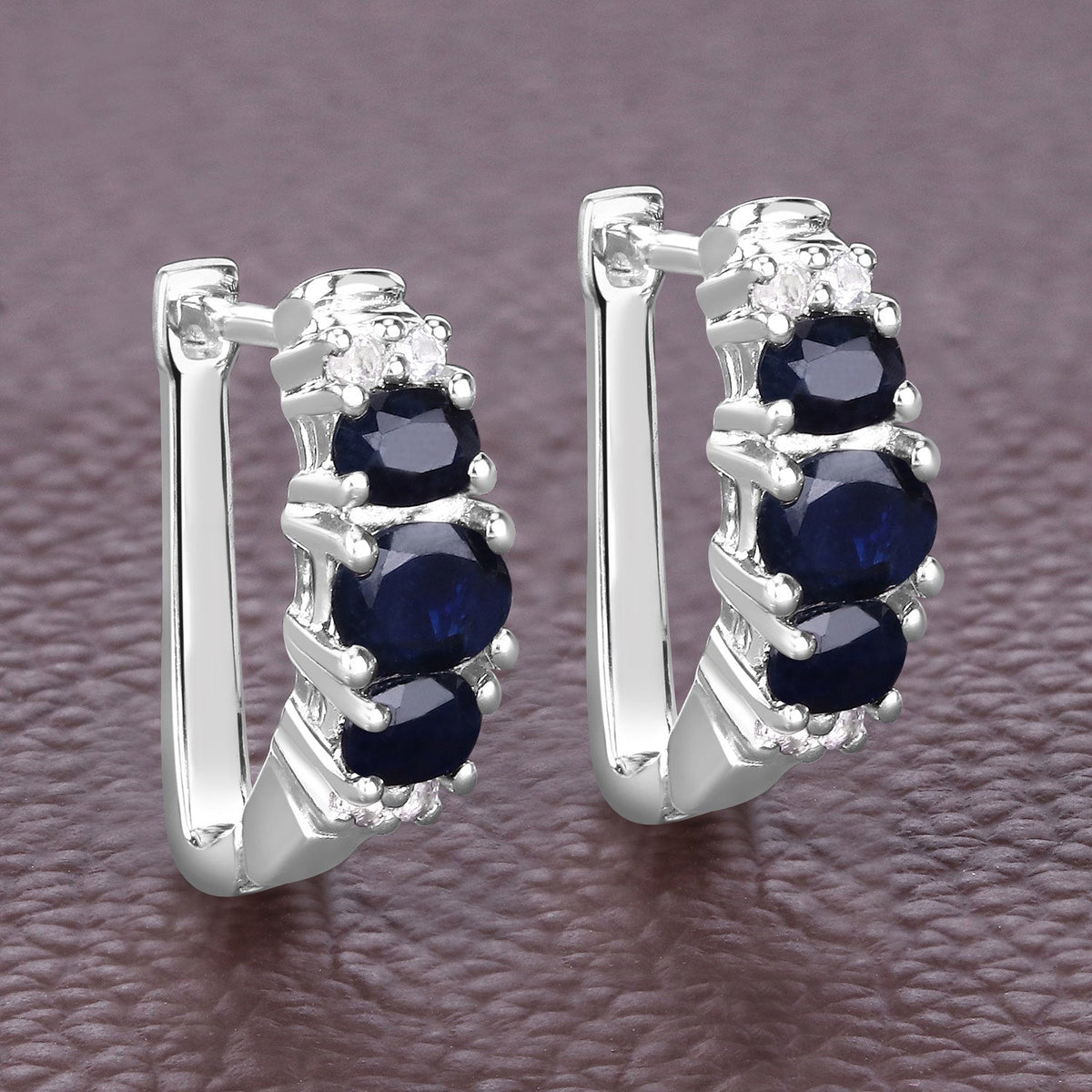 Pair of sterling silver earrings with blue sapphires and white topaz accents on Tampa Home & Garden Store