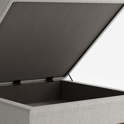 Square lift-top storage ottoman with gray fabric exterior and dark interior, metal hinges on Tampa Home & Garden Store
