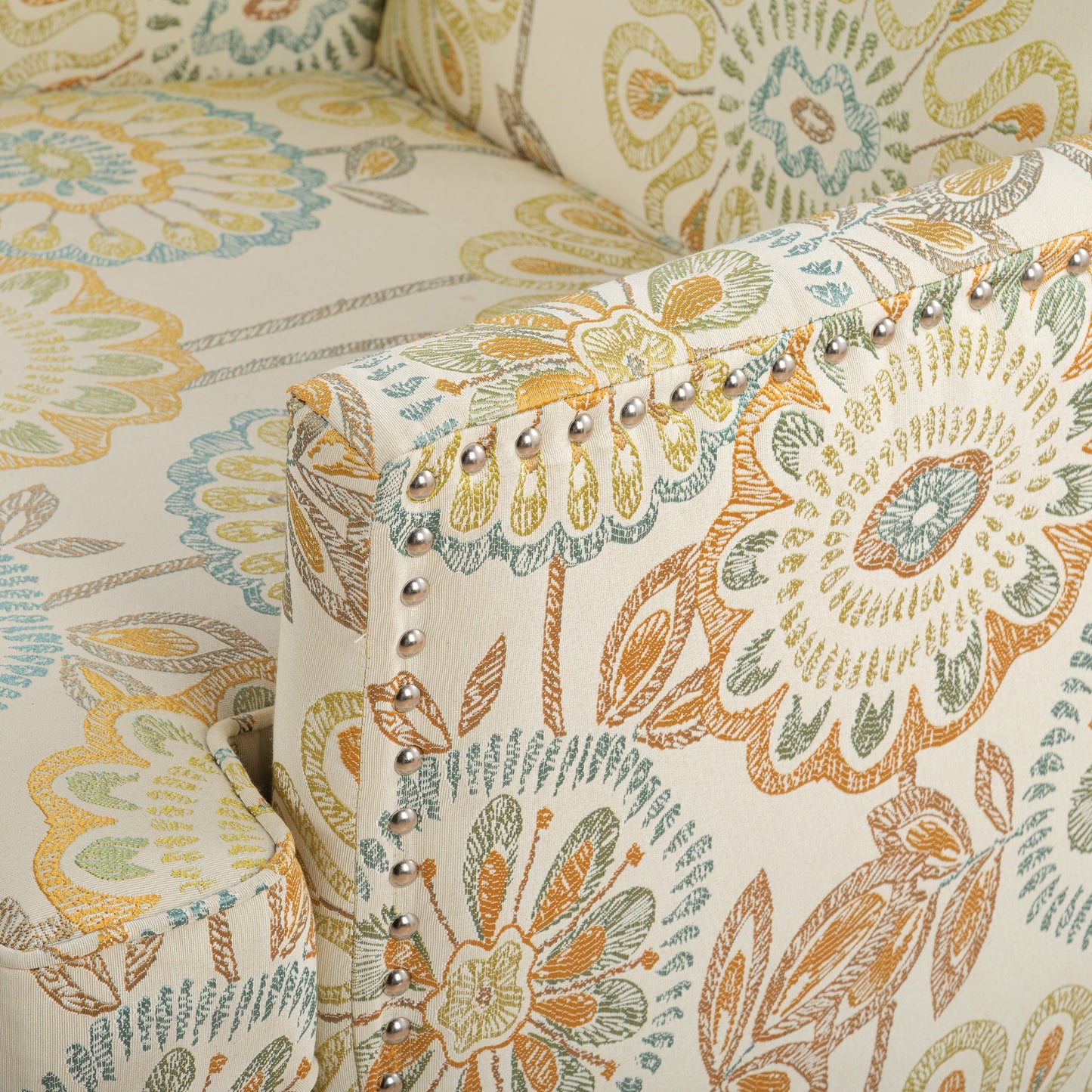Accent chairs fabric closeup with multicolor paisley pattern and metallic nailhead trim on Tampa Home & Garden Store