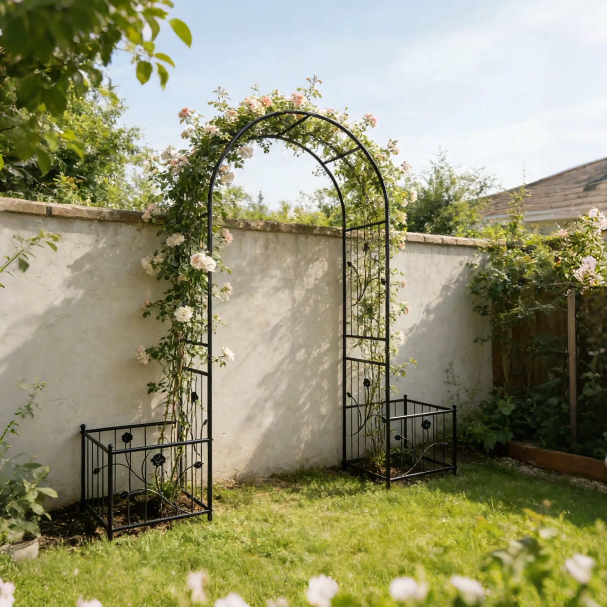 Black metal garden arch with two plant stands and climbing roses Unique Piece Furniture on Tampa Home & Garden Store
