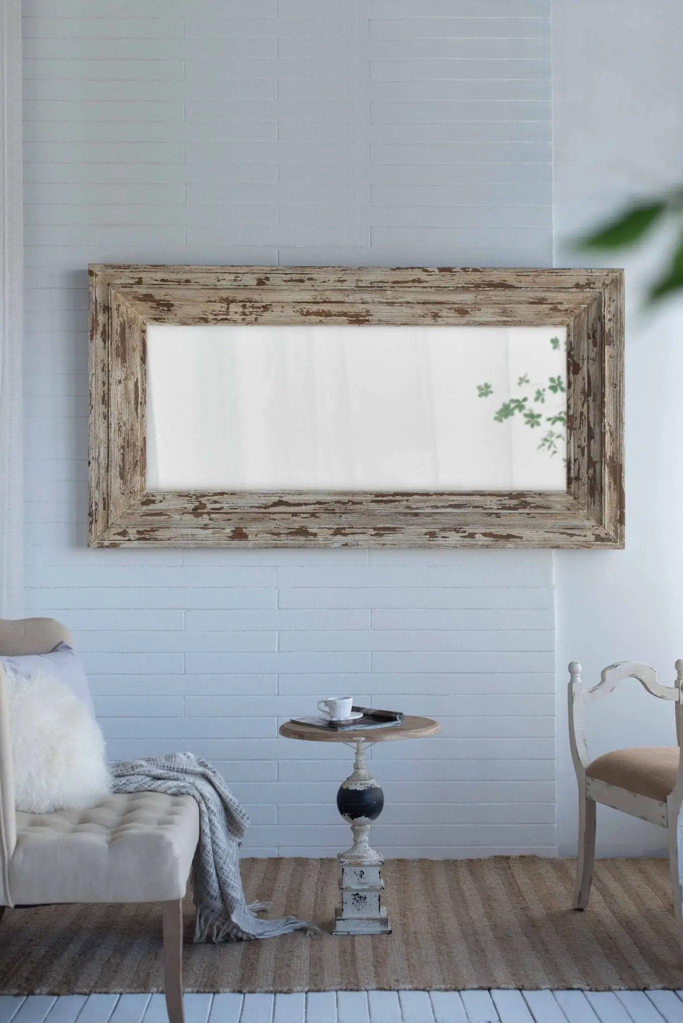 Full length rectangle floor mirror with distressed brown wood frame leaning on a blue wall on Tampa Home & Garden Store