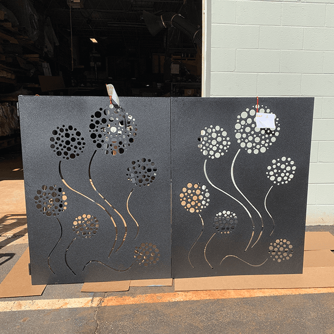 Two-panel outdoor privacy screen in gray steel with dandelion cutouts Rustica Ornamentals on Tampa Home & Garden Store