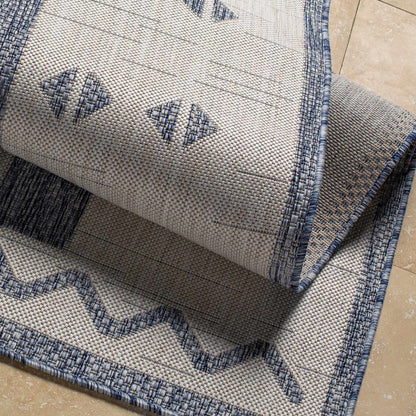 Dapitan Indoor/Outdoor Rug - Clearance; beige woven rug with blue border, Boutique Rugs on Tampa Home & Garden Store