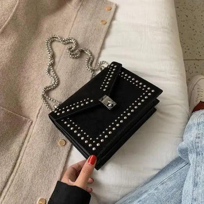 Stevvex black leather shoulder bag with silver rivets and chain strap crossbody on Tampa Home & Garden Store