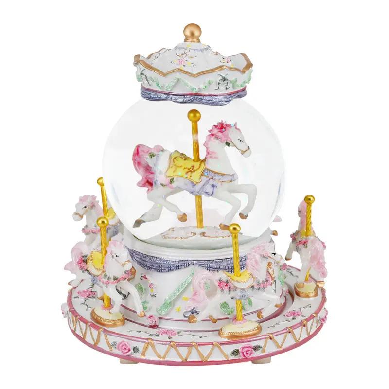 Crystal carousel music box with pink horse figurines, base and crown lid, gold accents on Tampa Home & Garden Store