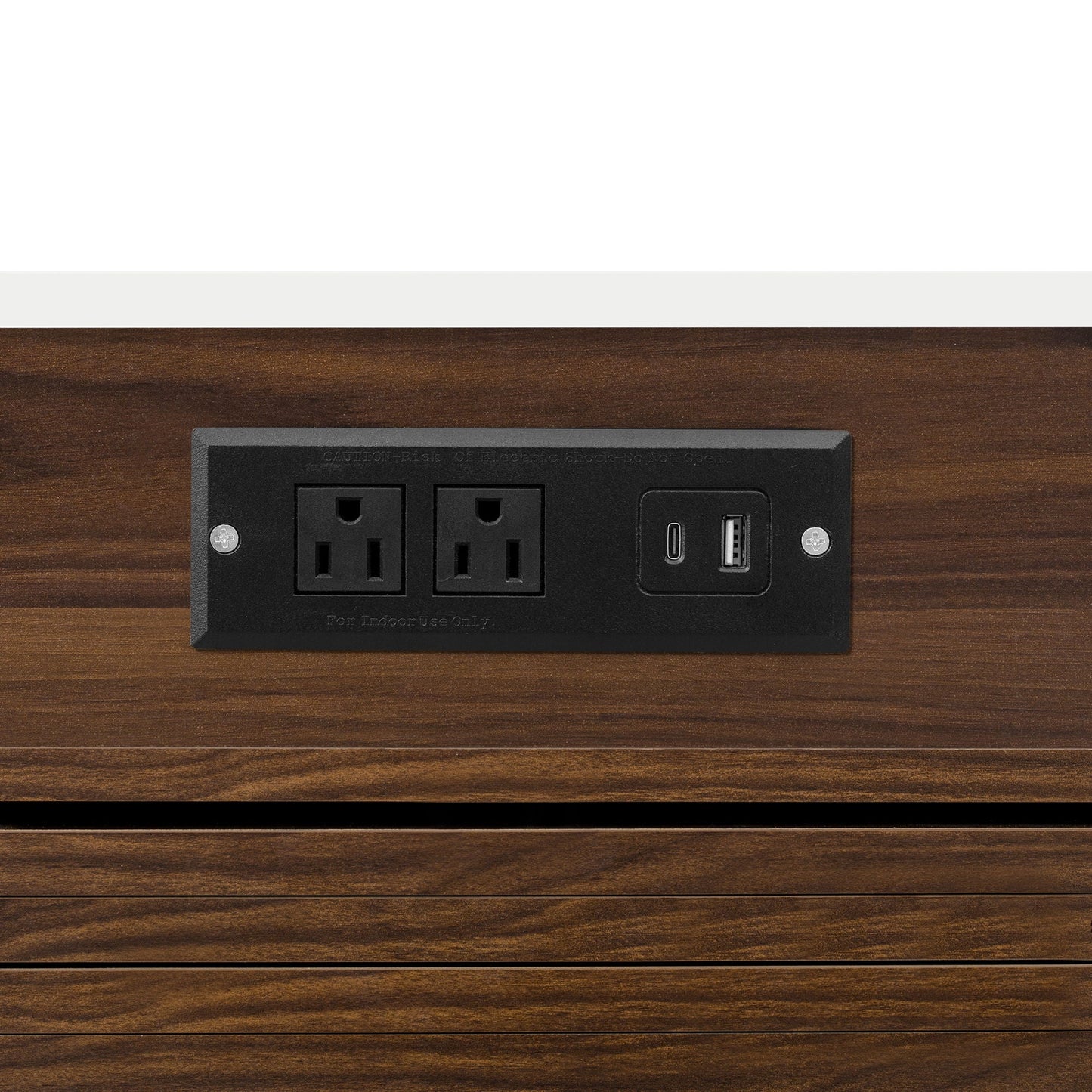 Black power outlet panel with two outlets and USB port on dark wood surface on Tampa Home & Garden Store