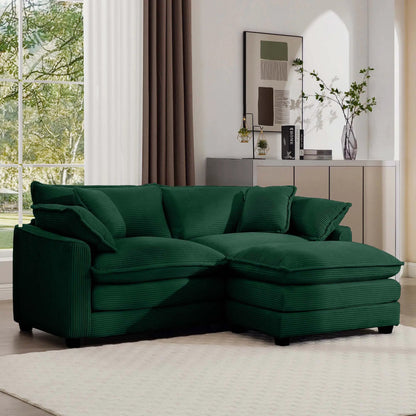 Modern oversized modular sofa with deep green cushions and ottoman on Tampa Home & Garden Store
