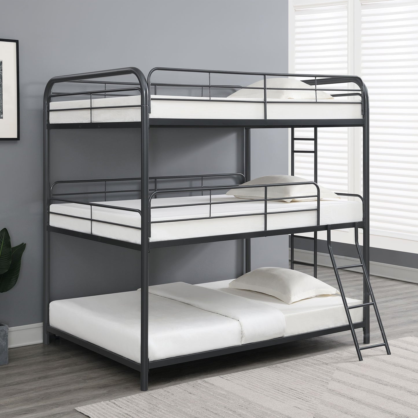 Triple bunk bed full size in black metal frame with guard rails and ladder on Tampa Home & Garden Store
