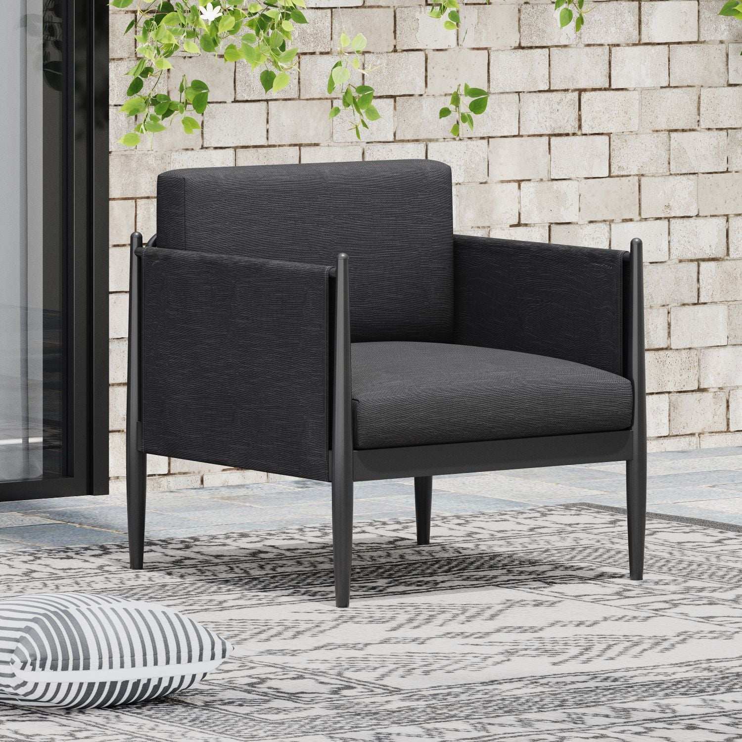 Dawson Club Chair outdoor arm chair in black textured fabric with metal frame on patio on Tampa Home & Garden Store