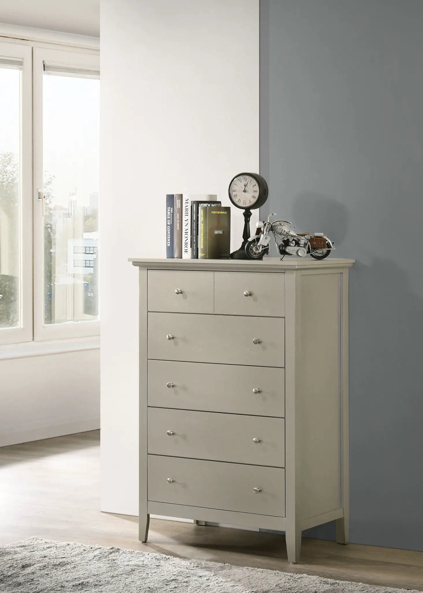 Hammond chest in light gray with metal knobs, clock and motorcycle model on top on Tampa Home & Garden Store