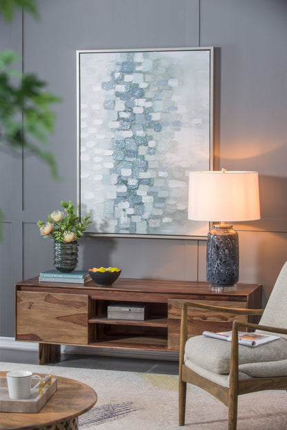 Ellis Glass Table Lamp with tall dark ceramic base and white shade on a wood console on Tampa Home & Garden Store