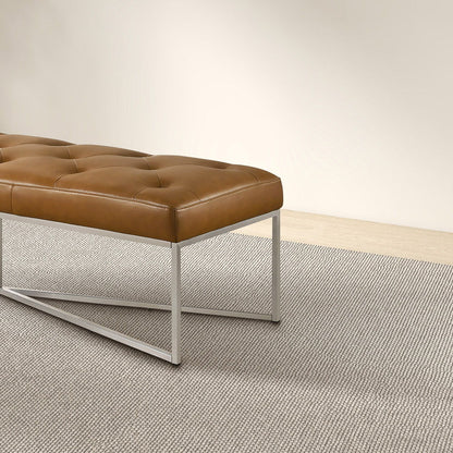 Harper Bench with tan tufted upholstered seat, solid teak frame and metal legs on Tampa Home & Garden Store