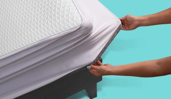 BedGear Ver-Tex King mattress protector white being stretched over mattress edge HouseOfZazla on Tampa Home & Garden Store