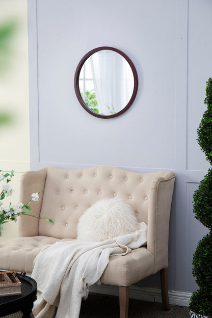 Circle wall mirror with dark wooden frame mounted on lavender living room wall on Tampa Home & Garden Store