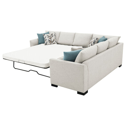 Radison upholstered sleeper sectional with hidden mattress in greige fabric, teal pillows on Tampa Home & Garden Store