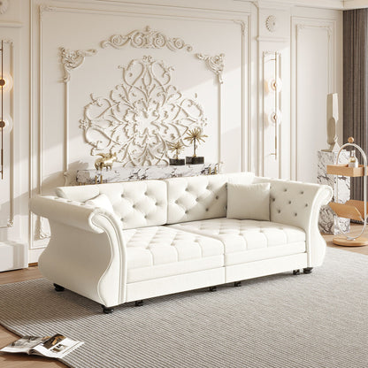 Oversized white Chesterfield pull-out sleeper sofa with roll-arm and flower tufting on Tampa Home & Garden Store
