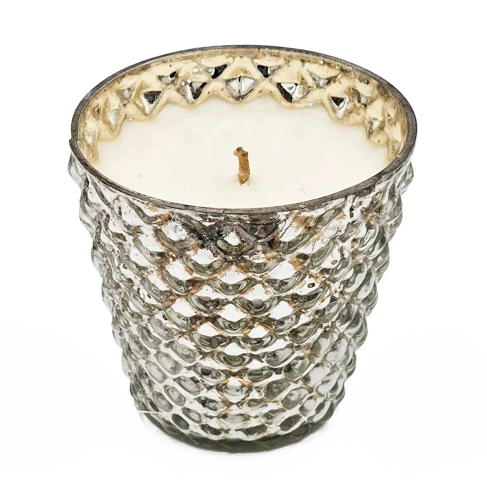 Scented soy wax candle in a hammered silver glass container with a centered wick on Tampa Home & Garden Store